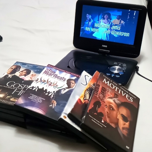 Other Naxa 9portable Dvd Player With 26 Dvds On And Off Switch On The